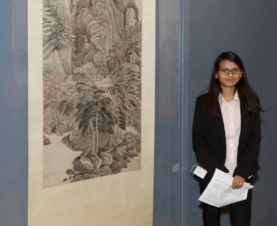 2015 Summer Academy student Kathya Lopez standing next to Reciting Poetry before the Yellowing of Autumn by Wu Li, Photo © Museum Associates/LACMA.