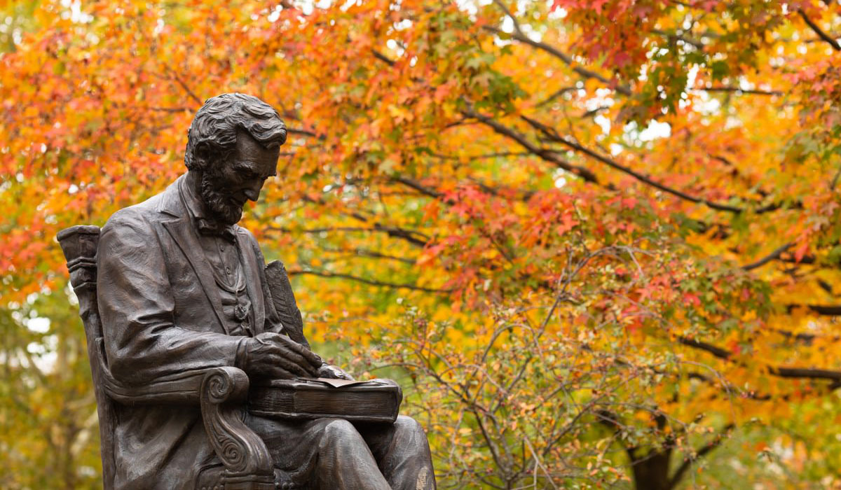 Lincoln Statue with fall leaves in the background