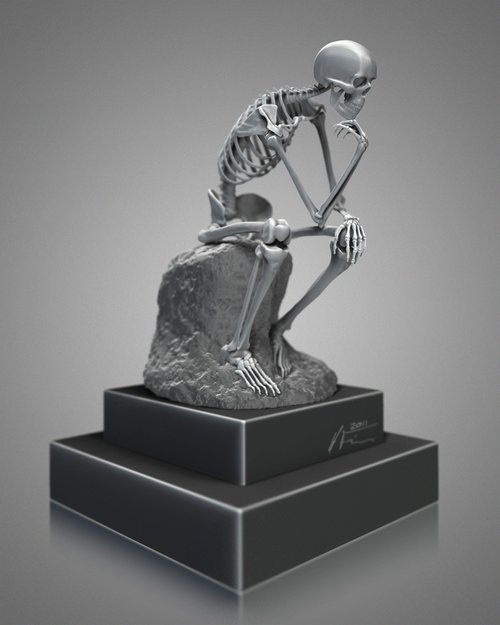 A skeleton sitting on a rock