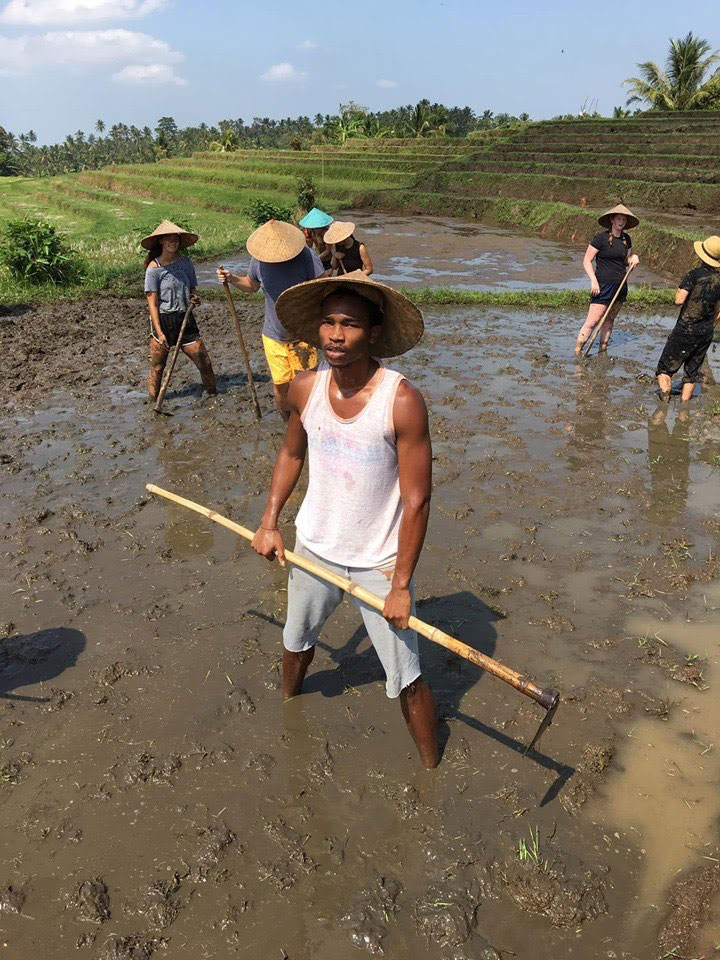 Churon T. Lanier-Martin tilling organic rice in Bali