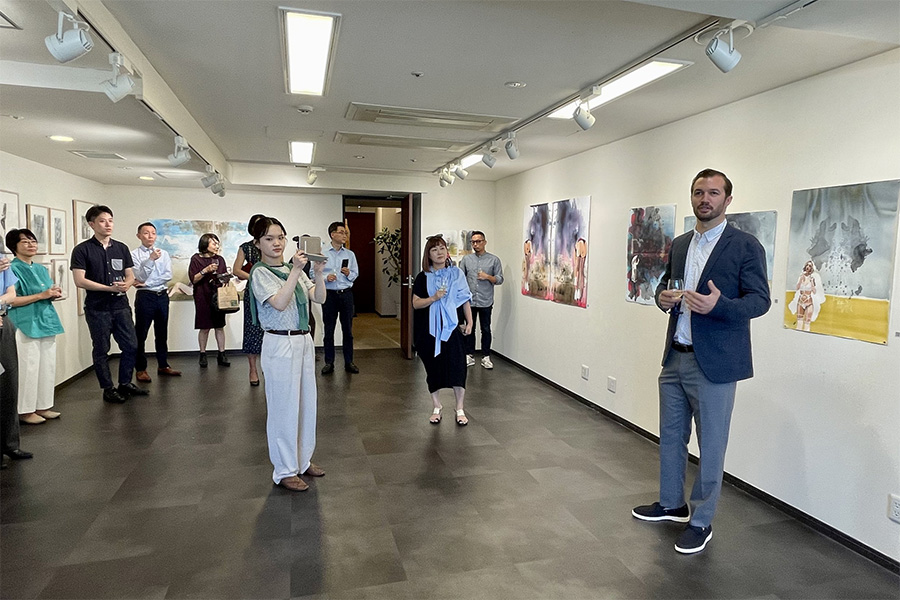 Prof. Austin Stiegemeier presents a gallery talk during the opening of his exhibition 