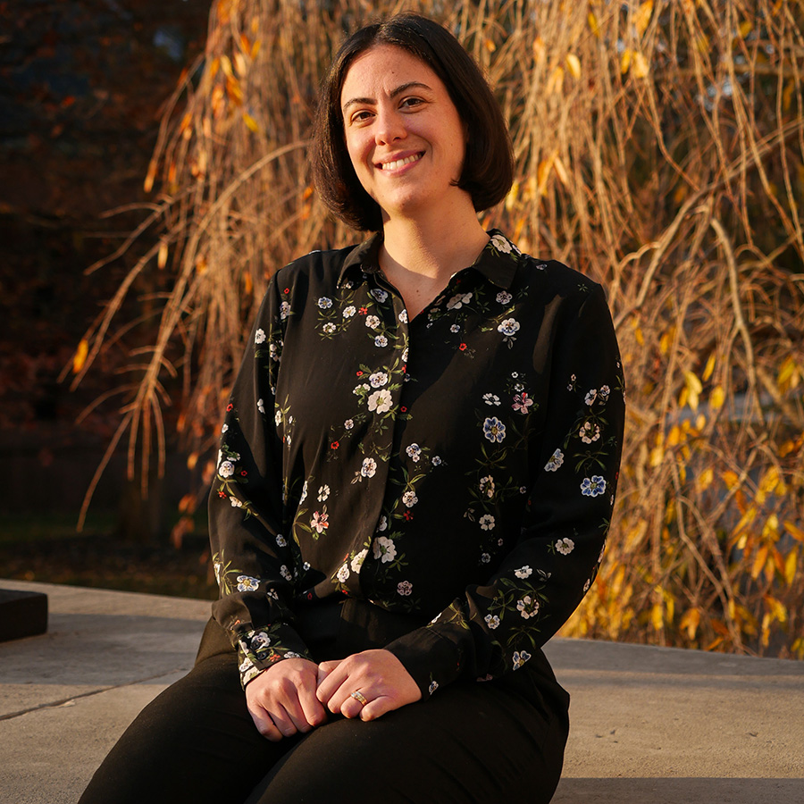 Prof. Hannah Greenwald on the steps of Weidensall Hall
