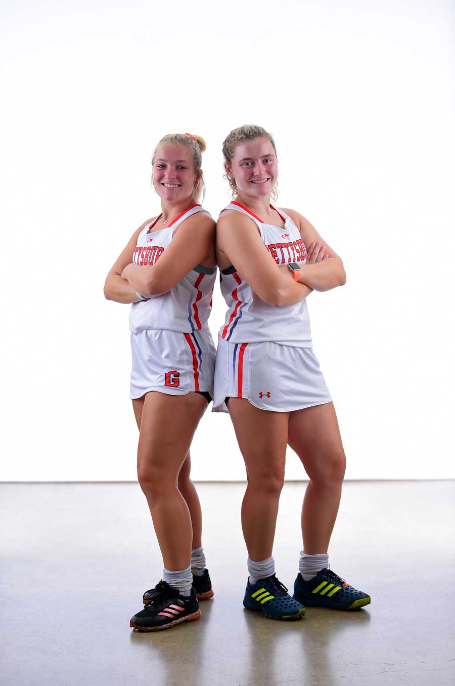 Charlotte and Greta Lacey wearing their Lacrosse uniforms
