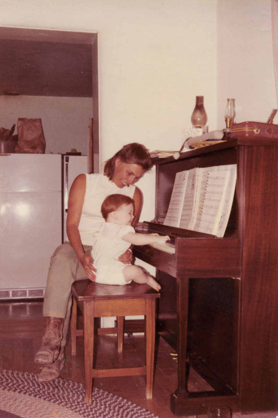 Jocelyn Swigger playing piano as a baby