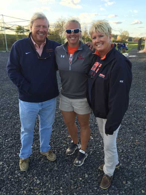 Hal and Teena Mowery posing with their daughter women's field hockey assistant coach Ashley Mowery
