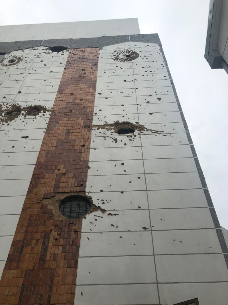 Holes in the side of the Parliament building in Kigali, Rwanda