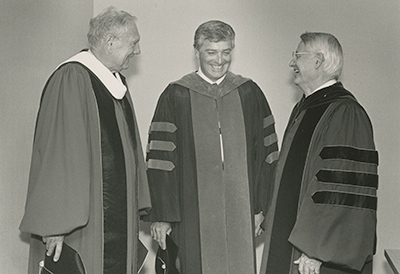 Haaland shown on his inaugeration day, flanked by interim president Charles Anderson (l) and former president Charles E. Glassick (r)
