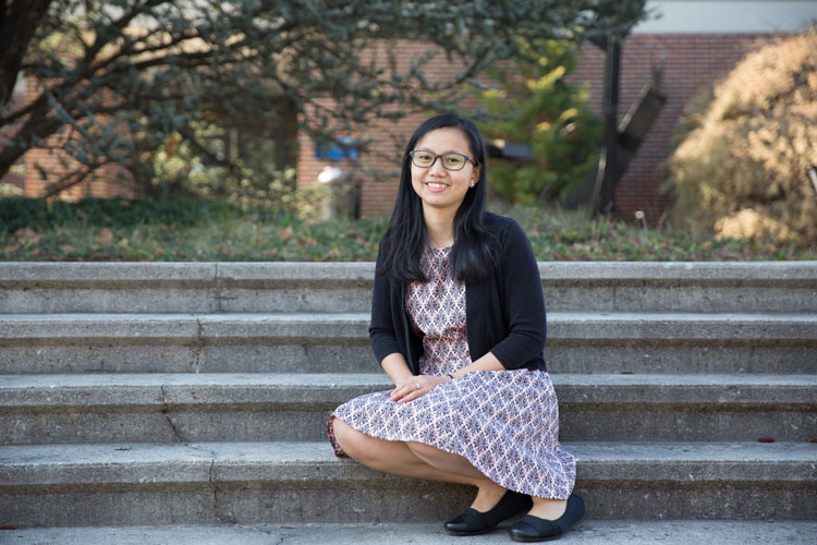 Vuochnear sitting on the steps of the Science Center