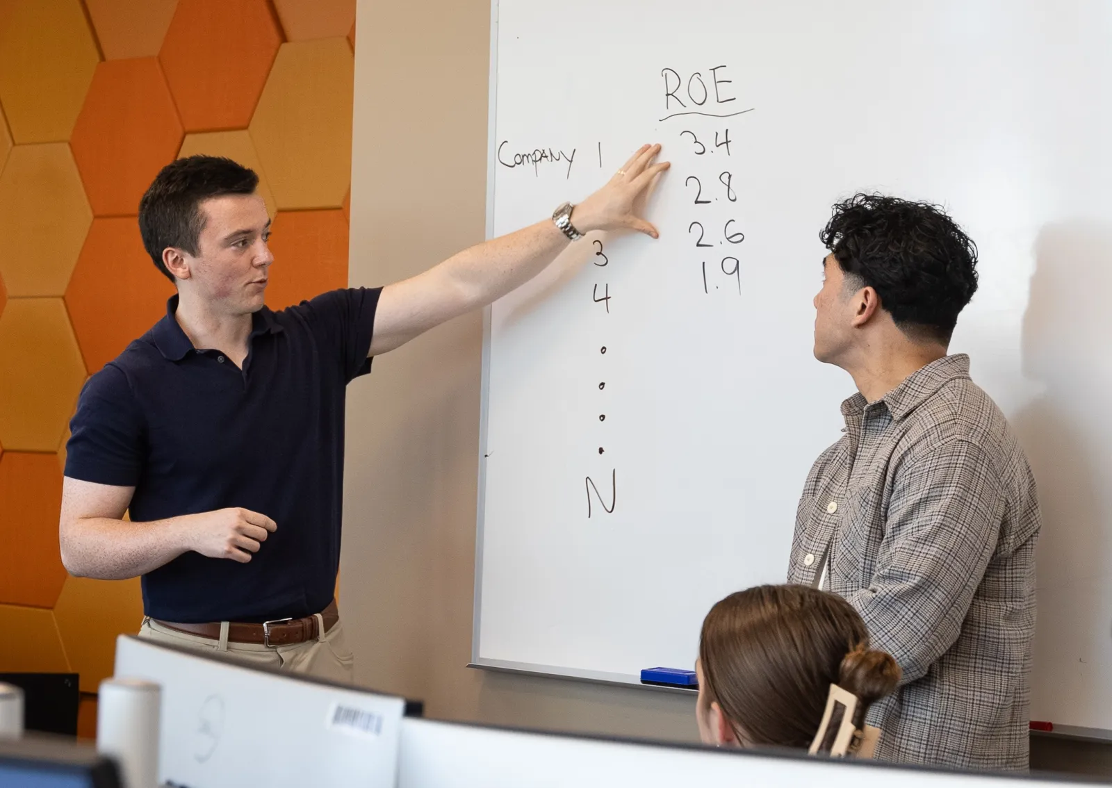 Kevin Klassen '19 and Kevin Benavente '20 teach a finance class in the Bloomberg Terminal Lab.