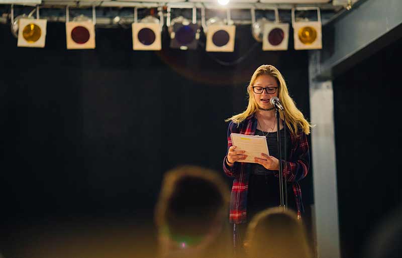 Writing Camp Student on stage Writing Camp Student on stage