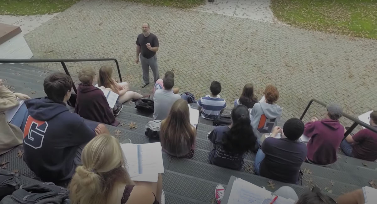 Steve Gimbel giving a lecture on the steps of Penn Hall