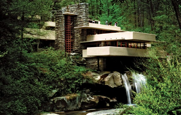 An architectural structure among green trees