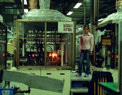 A child standing in a factory environment