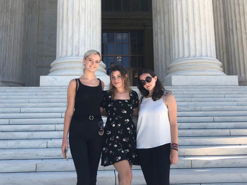 Supreme Court with students posing