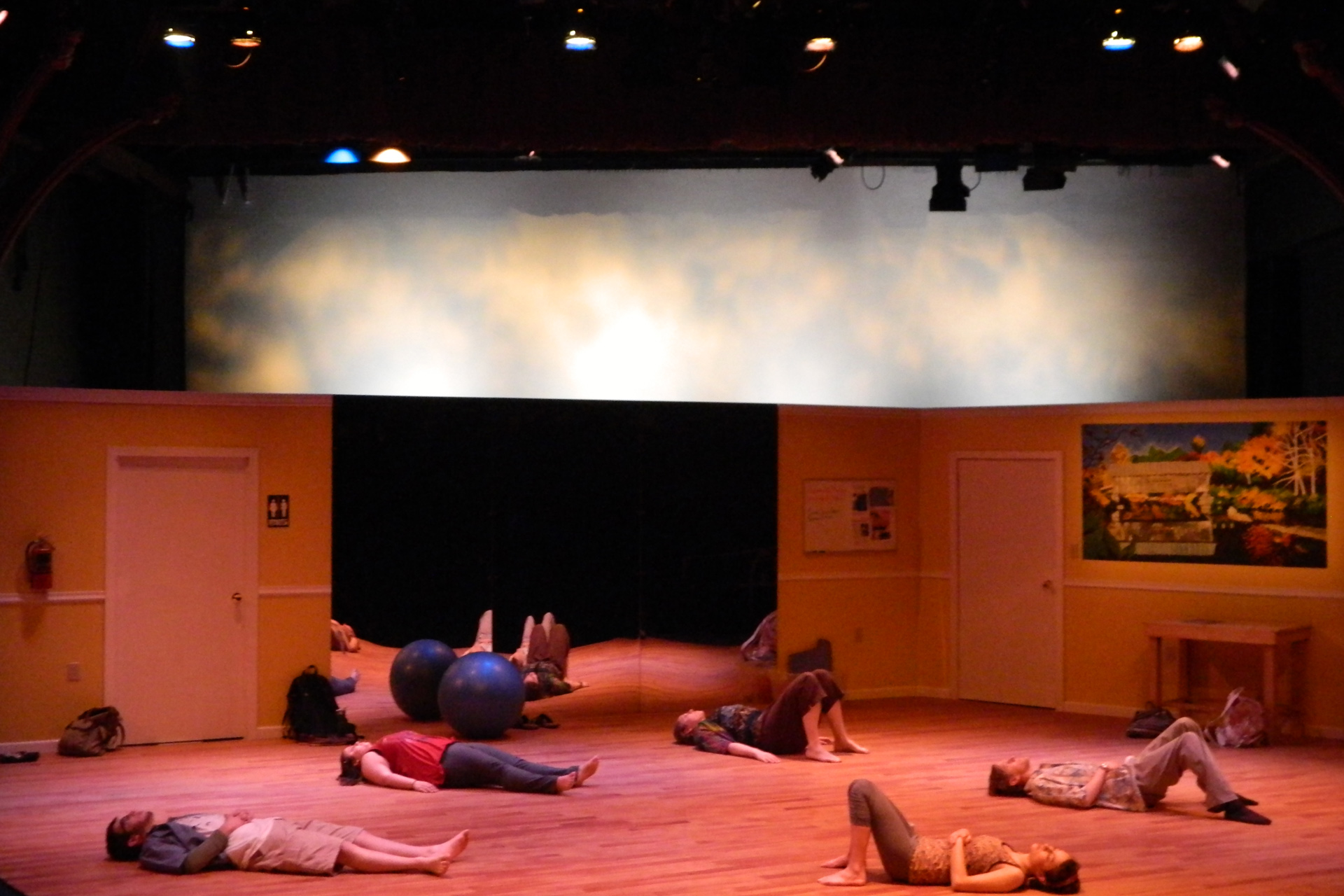 Actors laying on the floor in front of a mirror