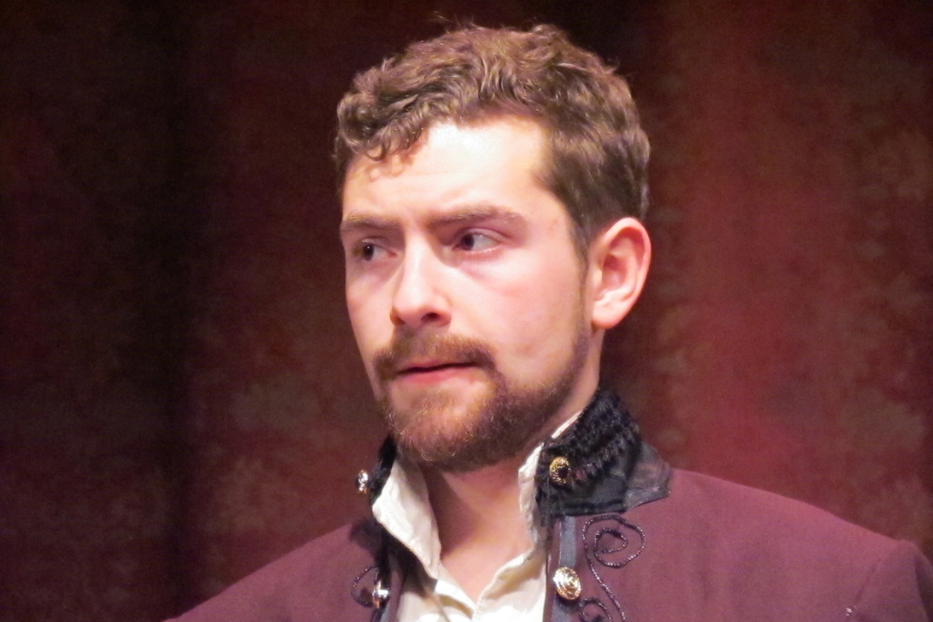 Headshot of actor in period attire