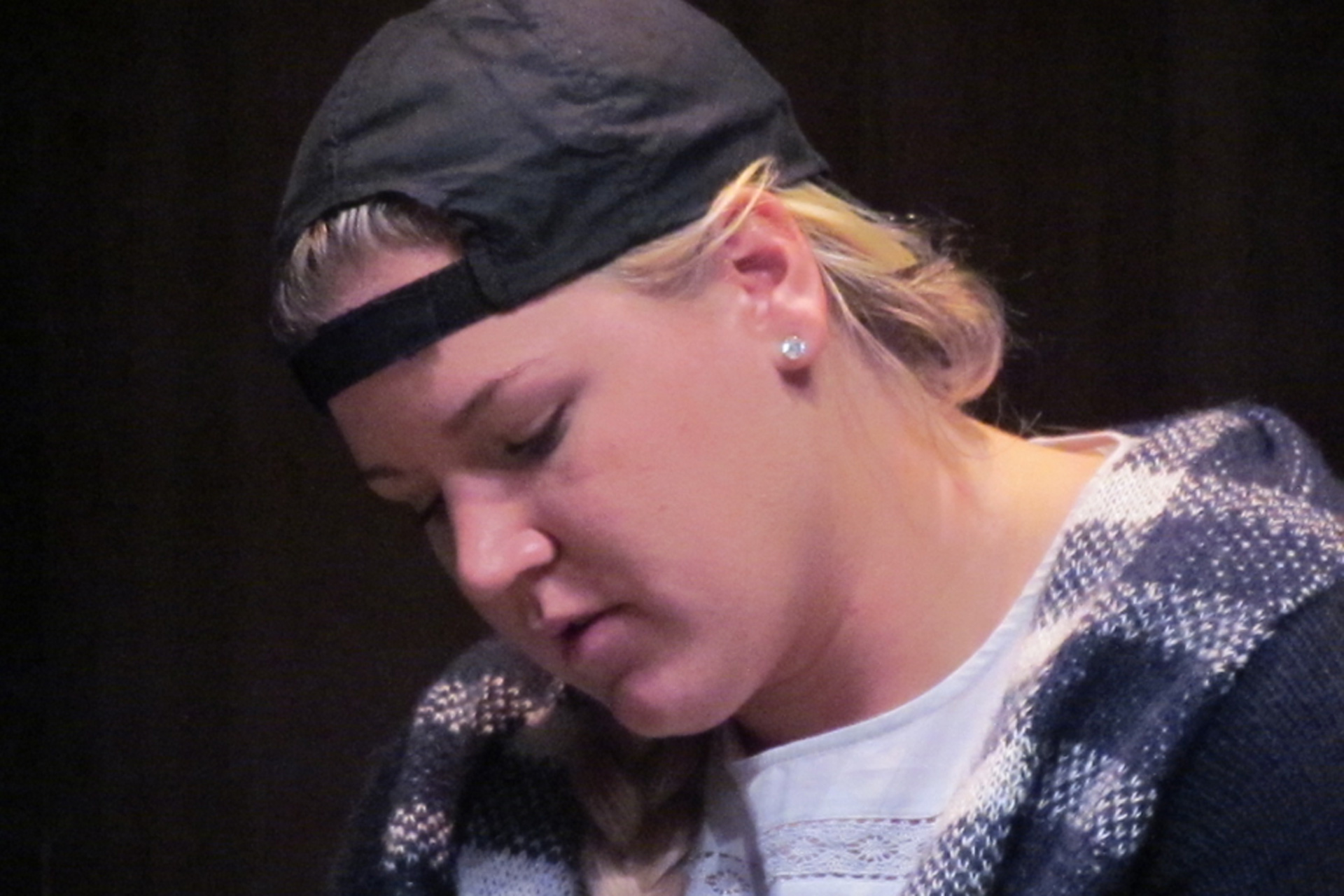 Close up of actress wearing baseball cap