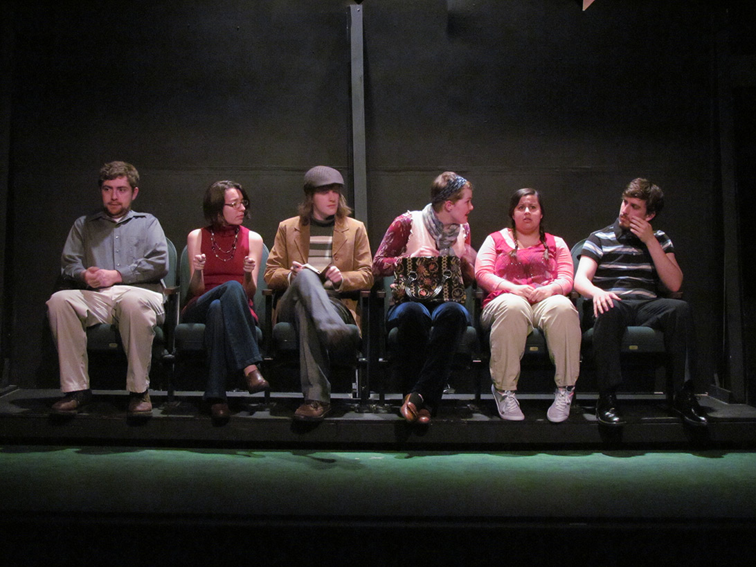 Actors and actresses sitting in a row