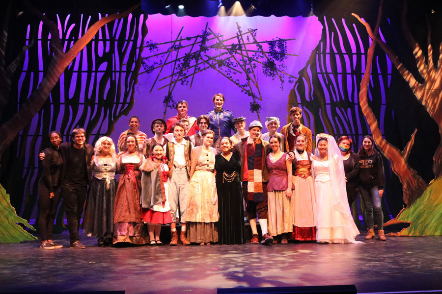 Group of students crowded together on stage