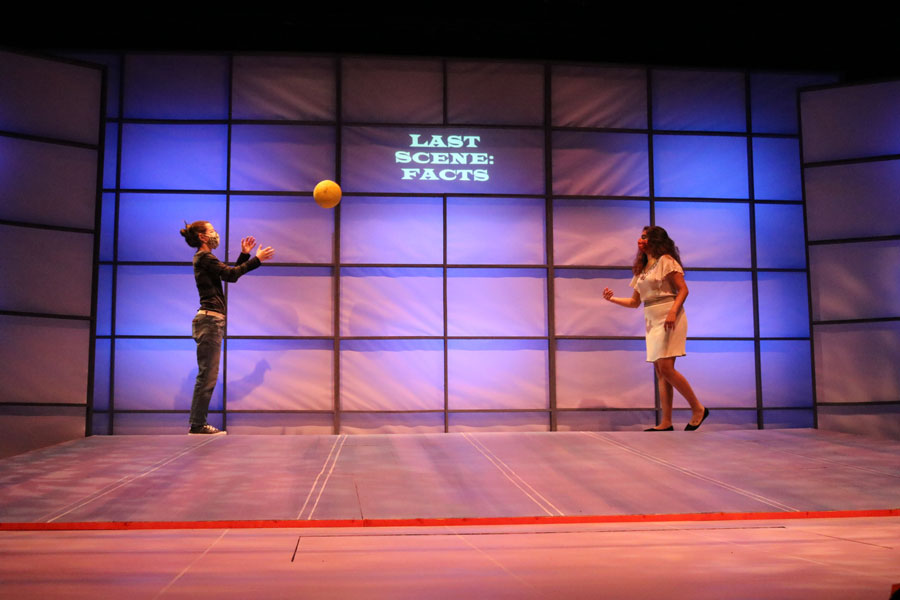 Two Girls throwing a ball to one another