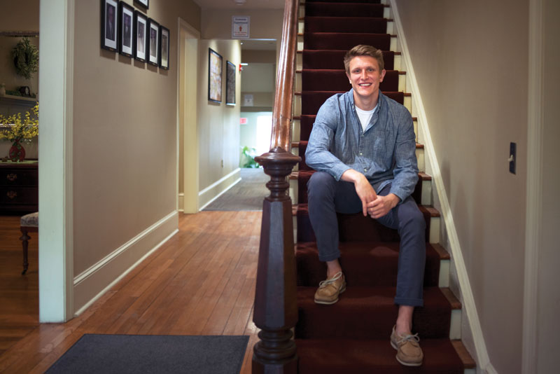 Tyler Mann '20 sitting on stairs