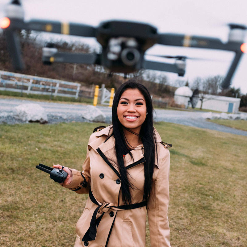 Student piloting drone to conduct flood research