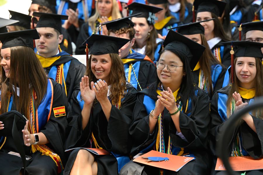 A picture of graduates clapping