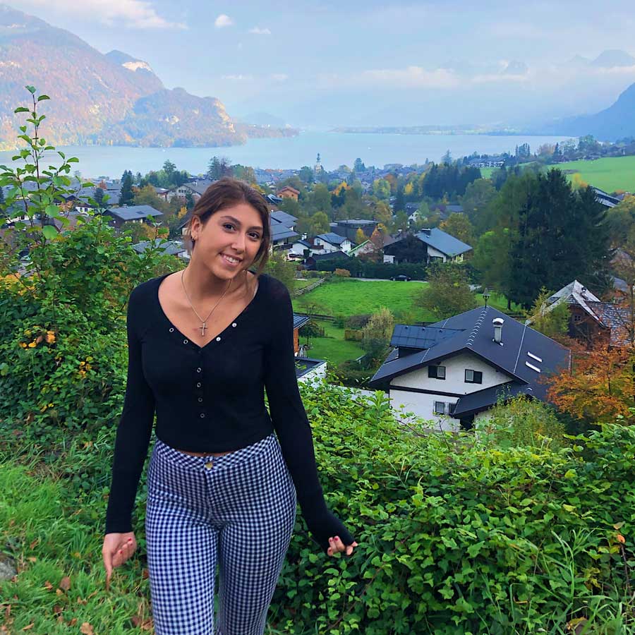 Tessa Damiano standing in front of a view of a town