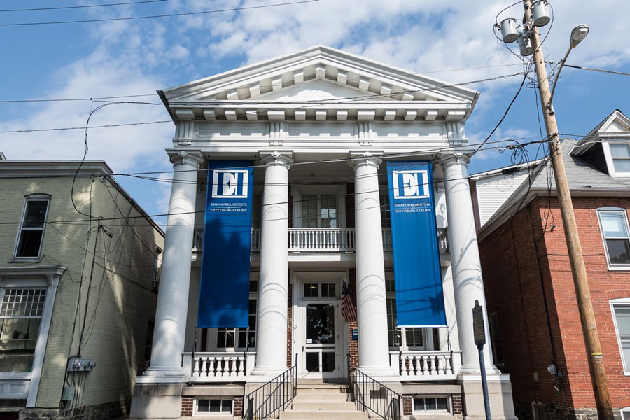 Photo of the front of the Eisenhower Institute with its blue banners