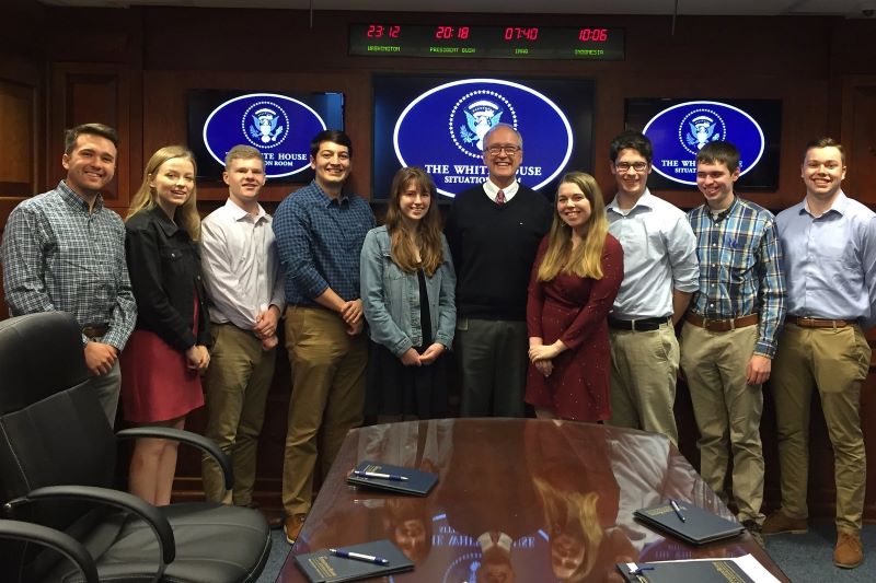 Students standing inside a White House room