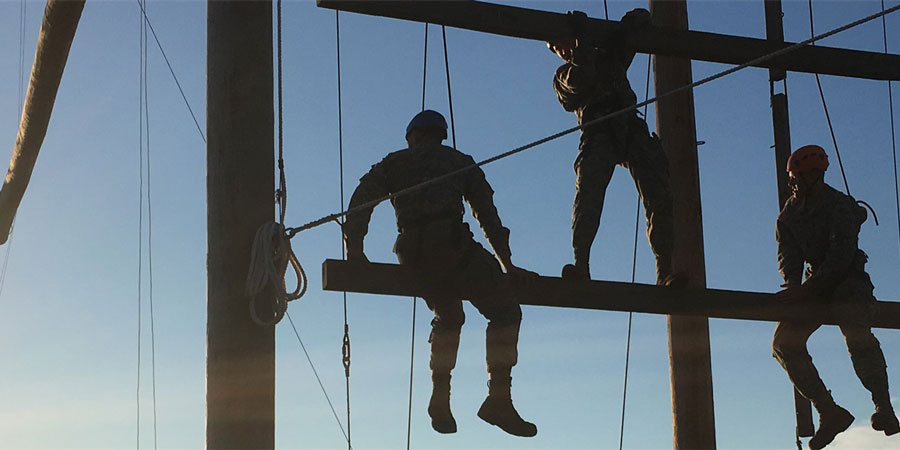 People climbing up a wooden structure