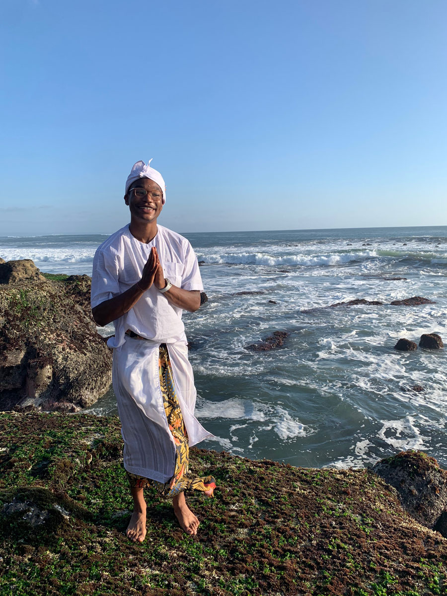Churon T. Lanier-Martin praying by the ocean