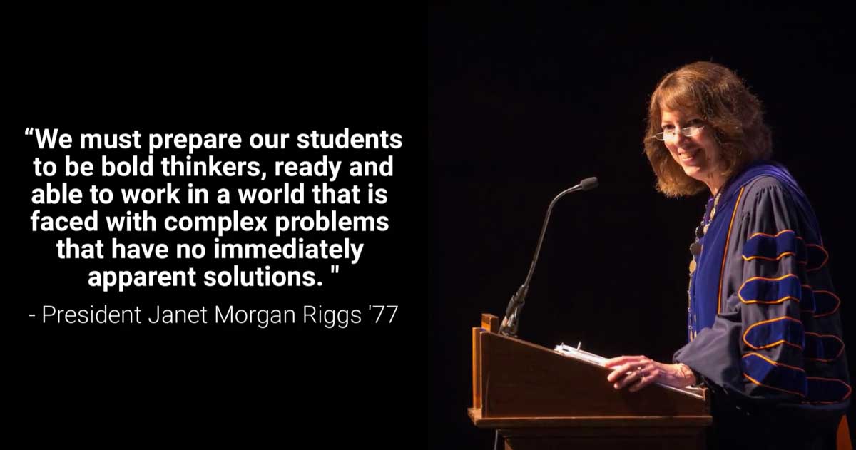 Janet Morgan Riggs standing on a podium on stage