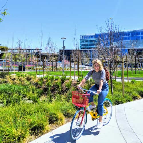 Shaina Wright ’08 riding a bike outdoor