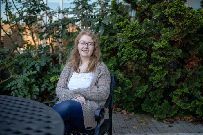 Brittany Bondi sitting at a table