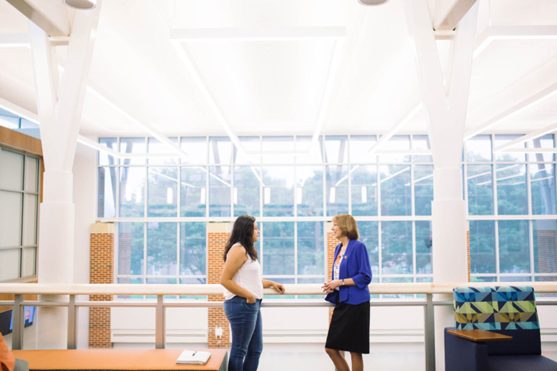 Pres. Riggs talking with Ivana Lopez-Espinosa '19