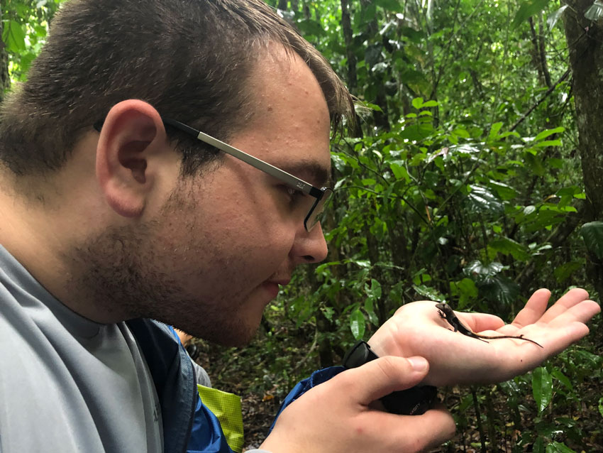 Lizard in the palm of a student's hand