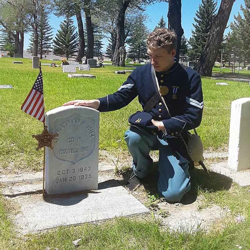 Jaeger Held visiting the grave of a Civil War veteran