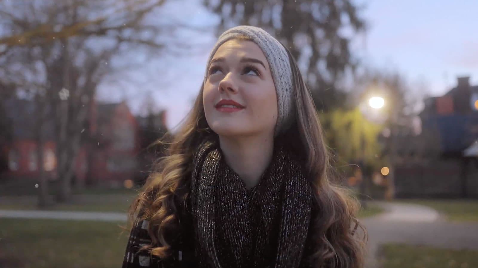 student walking through snow flurries at Gettysburg College