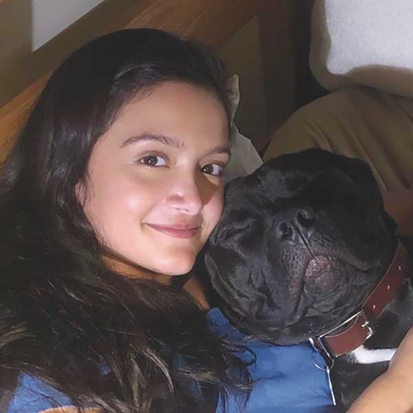 Anna Shah cuddling with her dog Bubba