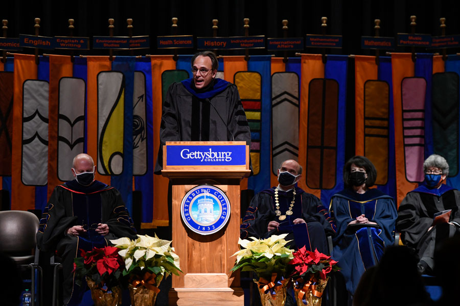 Alumni Professor Prof. Benjamin Kennedy speaking from a podium