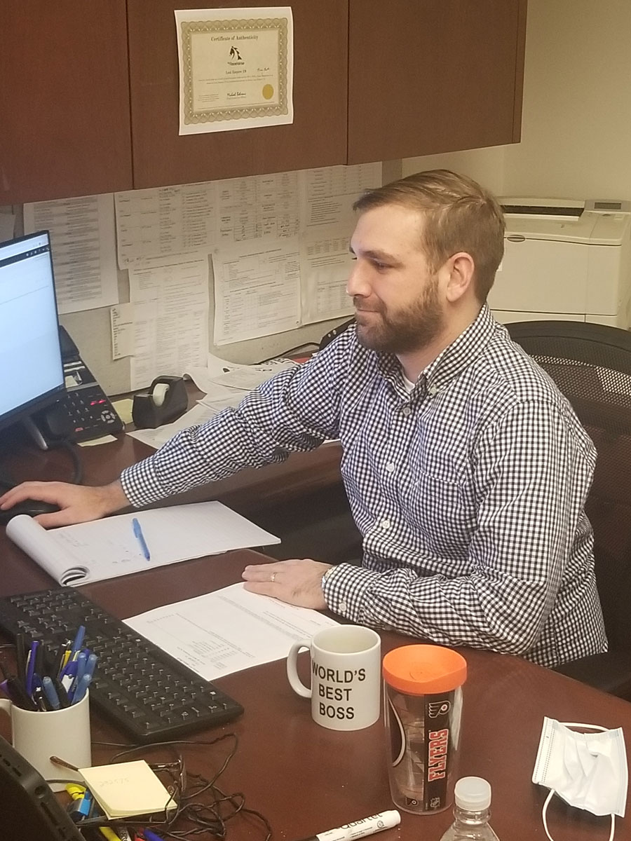 Bryan Barth working at his desk at the Philadelphia District Attorneys