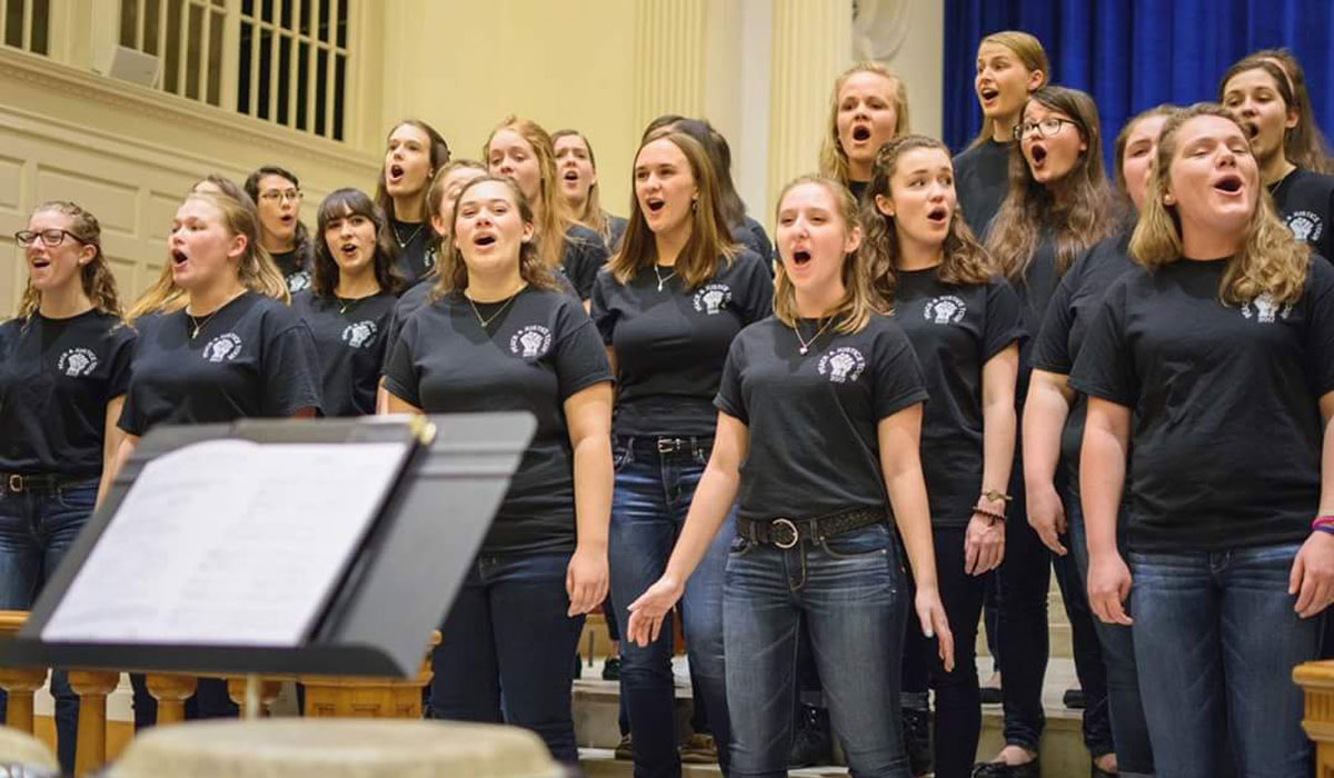 Female choir singing in a church