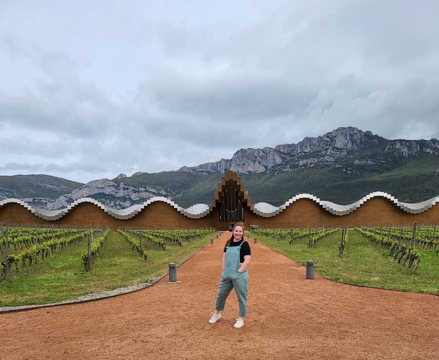 Caitlin Glance outside in front of a winery