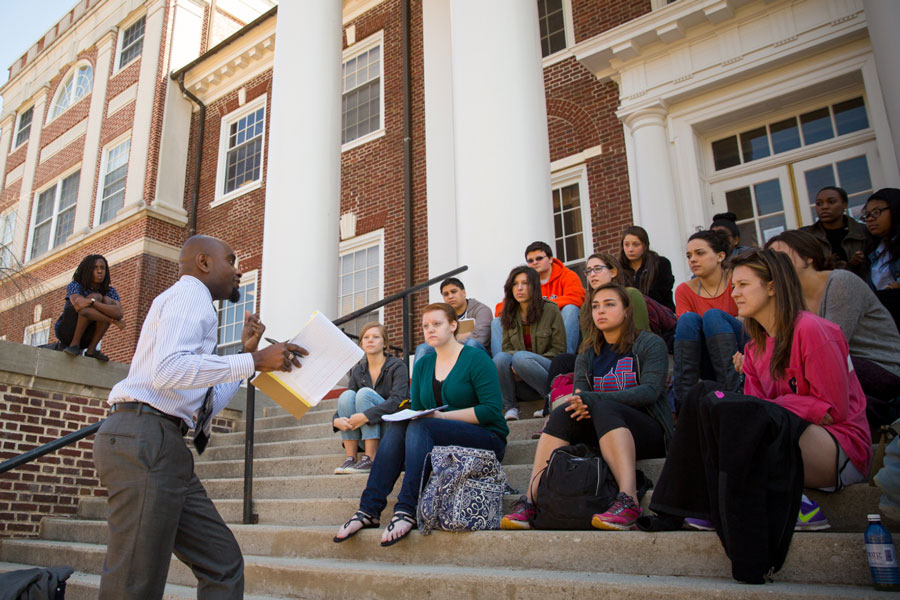 Prof. Hakim Mohandas Amani Williams teaching students outside of Weidensall Hall