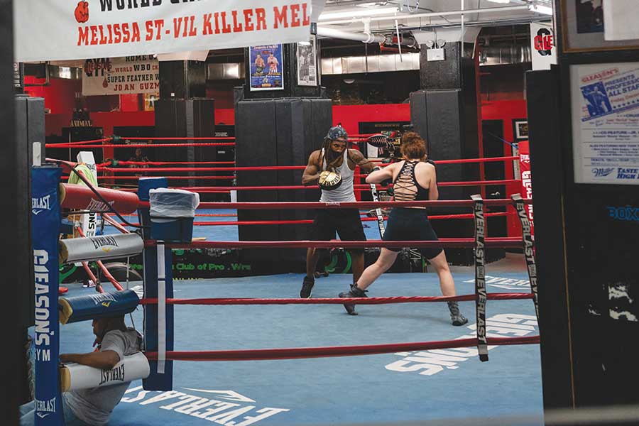 Two people boxing in the ring