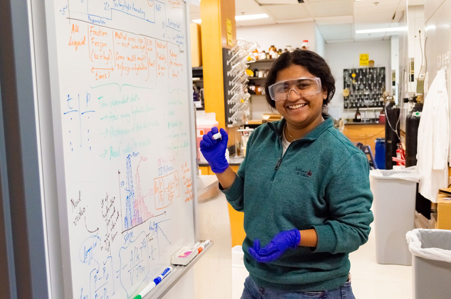 Meem Noshin Nawal Khan writing on a whiteboard in the lab