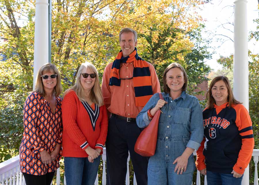 People posing for a photo on Orange and Blue day