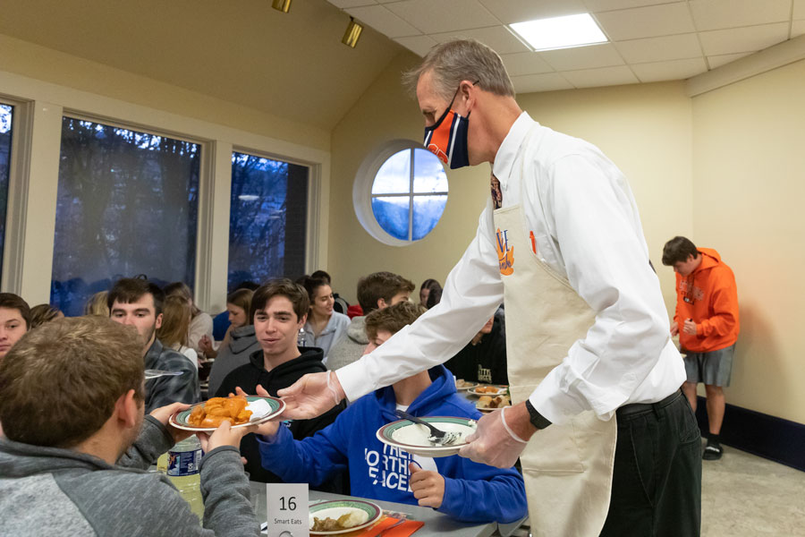 Joe Lynch speaking to students at Servo Thanksgiving