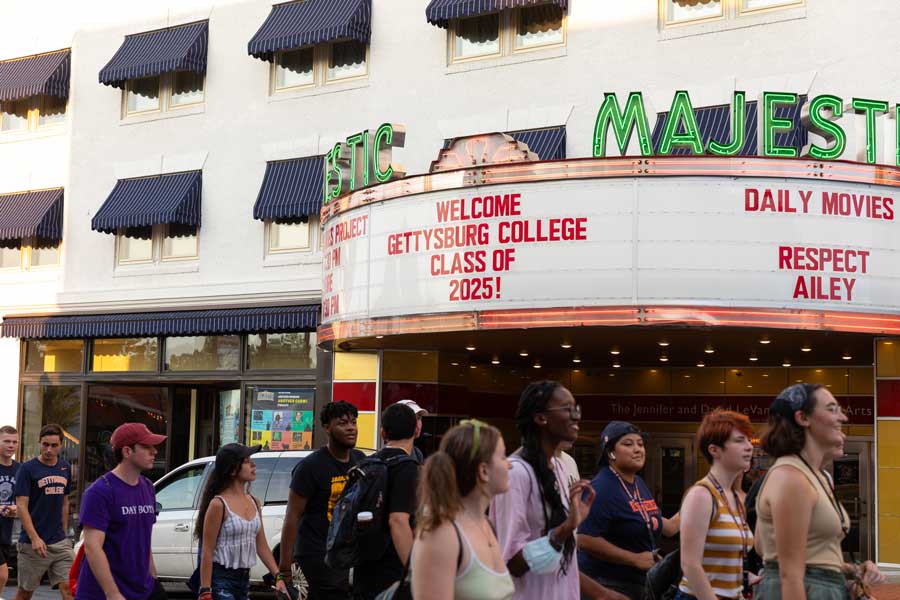 The Class of 2025 walking past the Majestic Theater